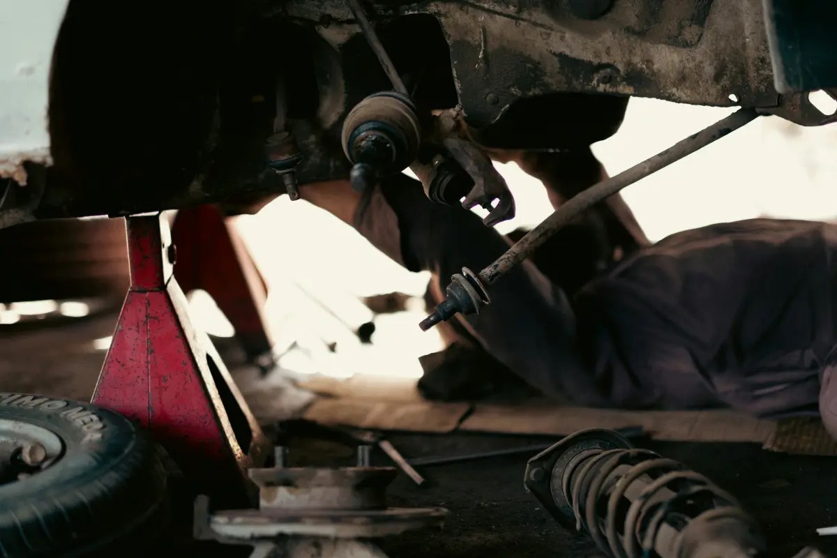 Suspension work from underneath a raised car