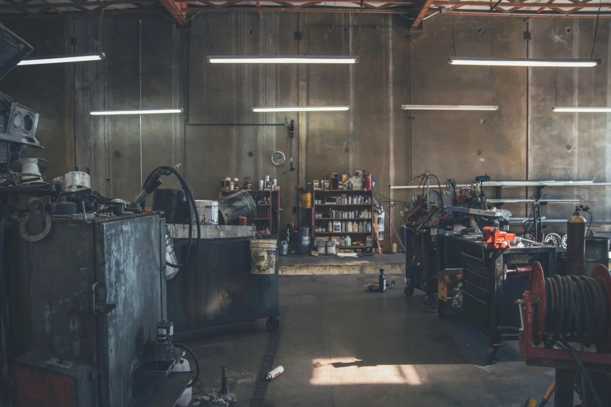 A wide view of an independent repair shop with benches and tool carts